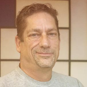 Headshot of Joe Voors, the founder and a therapist with a friendly smile.